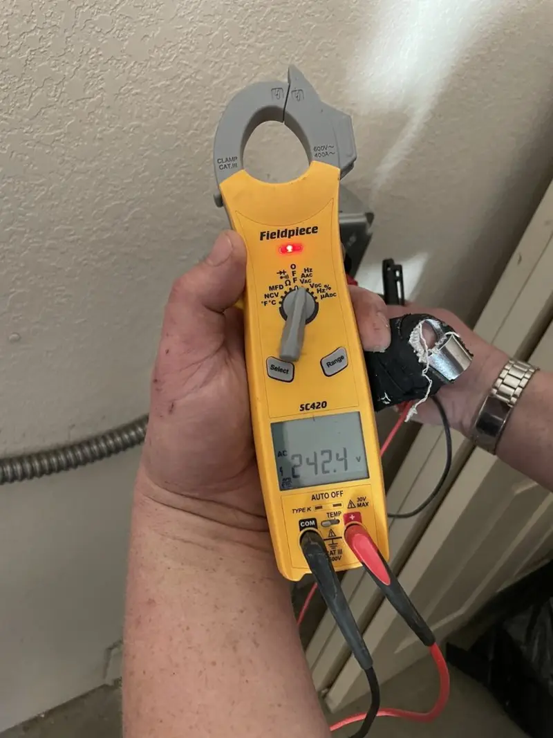 Voltage testing with clamp meter during Outlet Installation in Mather